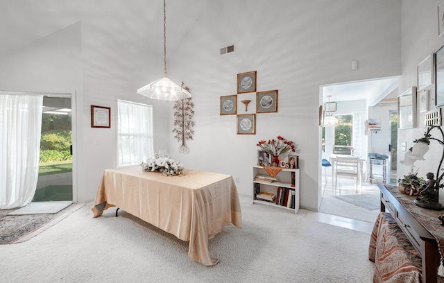 9109 N Chadwick Ln, Fresno, CA 93720 - dining area featuring healthy amount of natural light, high vaulted ceiling, and light carpet