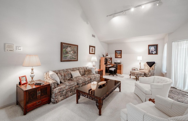 9109 N Chadwick Ln, Fresno, CA 93720 - carpeted living room with track lighting and high vaulted ceiling