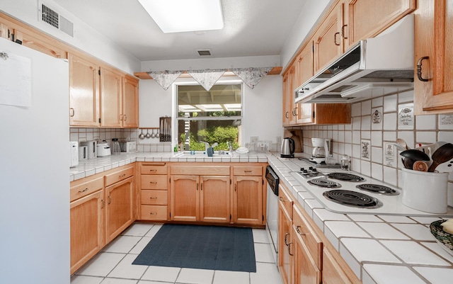 9109 N Chadwick Ln, Fresno, CA 93720 - kitchen with white appliances, tile counters, decorative backsplash, and light tile patterned flooring