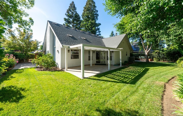 9109 N Chadwick Ln, Fresno, CA 93720 - back of property featuring roof with shingles, a patio area, stucco siding, a lawn, and central AC