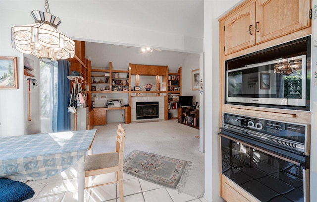 9109 N Chadwick Ln, Fresno, CA 93720 - kitchen with oven, a chandelier, built in microwave, and a fireplace