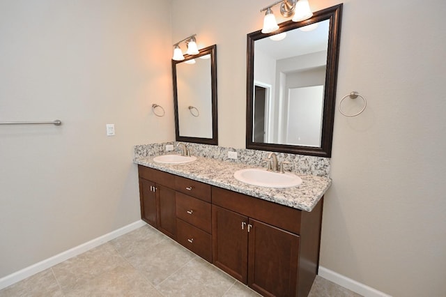 3368 Monterosa Ln, Clovis, CA 93619 - full bathroom with double vanity, baseboards, and tile patterned floors