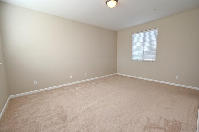 3368 Monterosa Ln, Clovis, CA 93619 - spare room featuring light colored carpet and baseboards