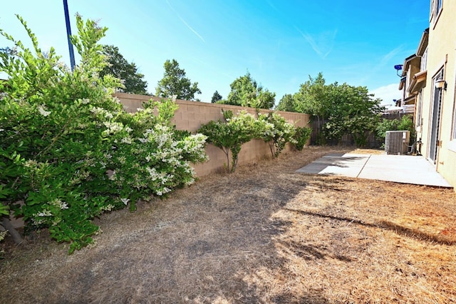 3368 Monterosa Ln, Clovis, CA 93619 - fenced backyard featuring a patio and central AC unit
