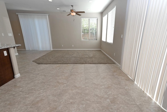 3368 Monterosa Ln, Clovis, CA 93619 - empty room with ceiling fan, recessed lighting, light tile patterned floors, and baseboards