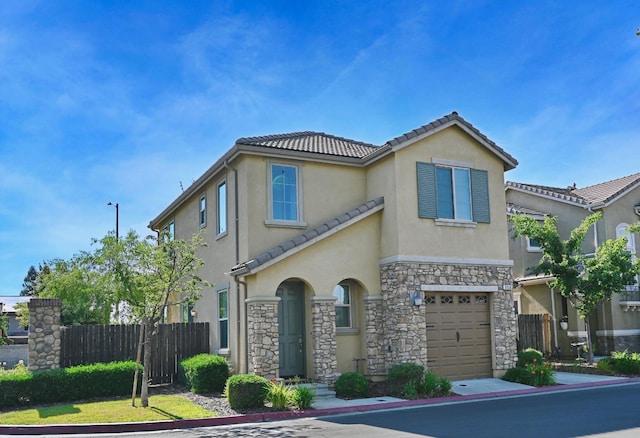 3368 Monterosa Ln, Clovis, CA 93619 - view of front of house featuring stucco siding, stone siding, an attached garage, and a tile roof