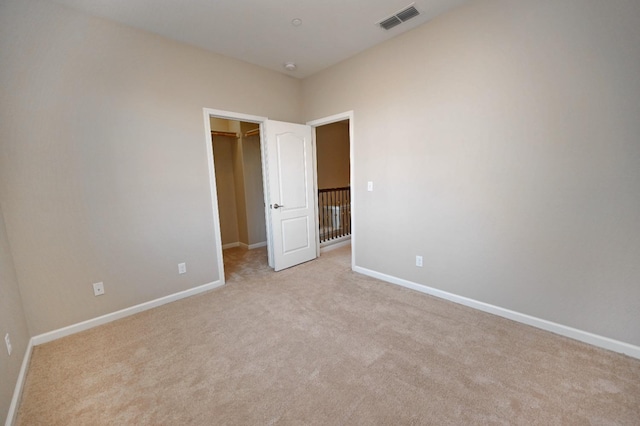 3368 Monterosa Ln, Clovis, CA 93619 - unfurnished bedroom with light colored carpet, a walk in closet, and baseboards