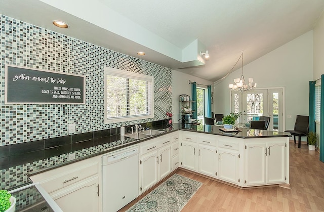 38830 Littlefield Rd, Shaver Lake, CA 93664 - kitchen featuring dishwasher, a sink, dark countertops, vaulted ceiling, and a chandelier