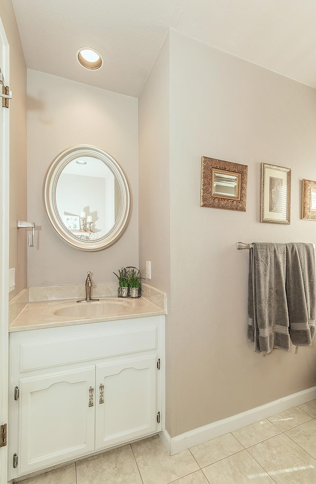 38830 Littlefield Rd, Shaver Lake, CA 93664 - bathroom with tile patterned floors, vanity, and baseboards