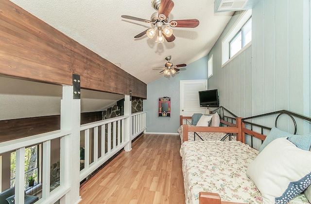 38830 Littlefield Rd, Shaver Lake, CA 93664 - bedroom with lofted ceiling, wood finished floors, a textured ceiling, a ceiling fan, and baseboards