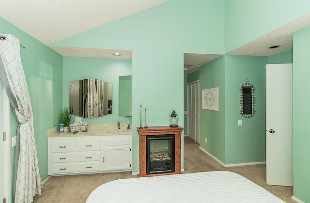 38830 Littlefield Rd, Shaver Lake, CA 93664 - bedroom with a sink, lofted ceiling, baseboards, light colored carpet, and a textured ceiling