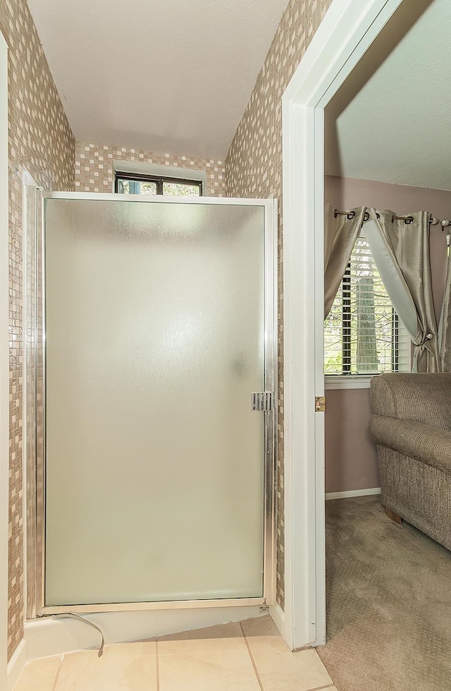 38830 Littlefield Rd, Shaver Lake, CA 93664 - bathroom featuring wallpapered walls, a stall shower, and baseboards