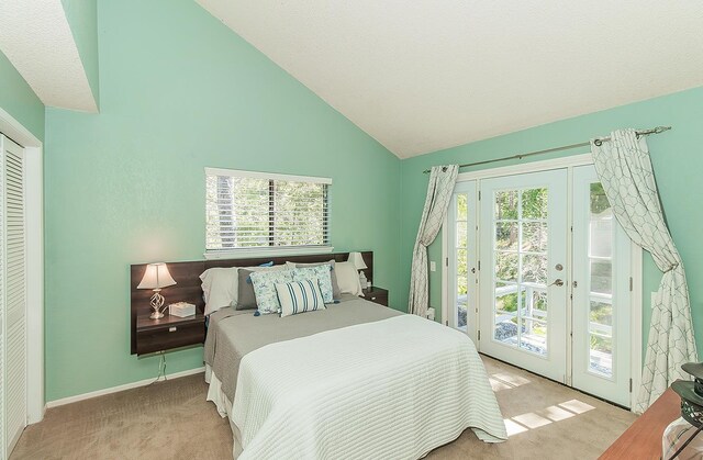 38830 Littlefield Rd, Shaver Lake, CA 93664 - bedroom with carpet, access to exterior, high vaulted ceiling, multiple windows, and french doors