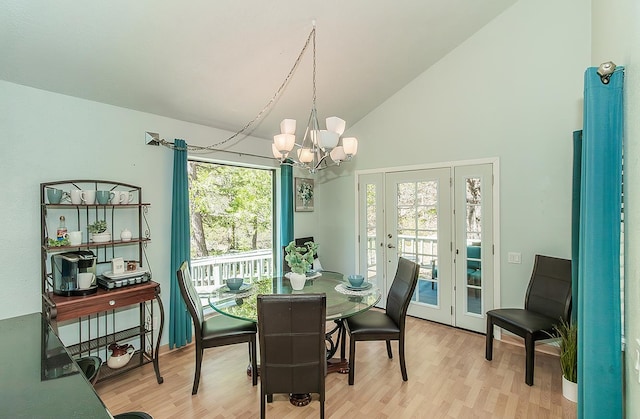 38830 Littlefield Rd, Shaver Lake, CA 93664 - dining area featuring a chandelier, french doors, light wood-style floors, and high vaulted ceiling