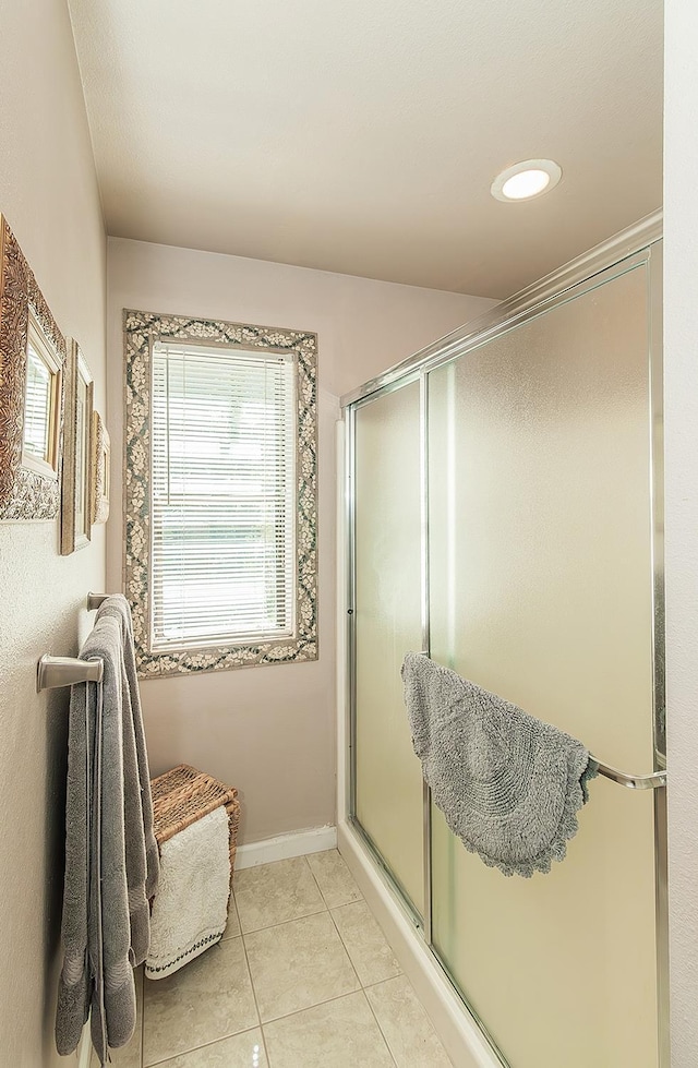 38830 Littlefield Rd, Shaver Lake, CA 93664 - bathroom featuring tile patterned floors, a shower with door, and baseboards
