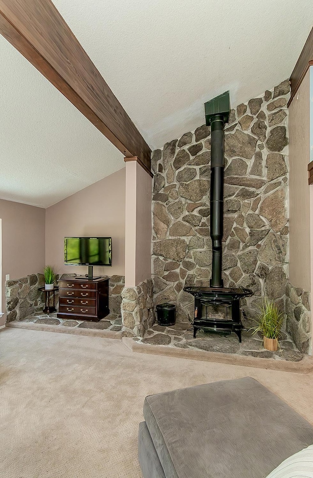 38830 Littlefield Rd, Shaver Lake, CA 93664 - living area with carpet, a wood stove, and a textured ceiling
