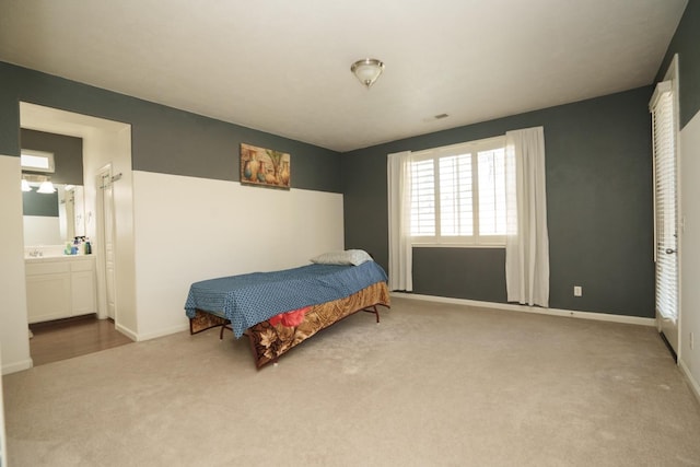 5138 W Beechwood Ave, Fresno, CA 93722 - bedroom featuring carpet, baseboards, a sink, and ensuite bath