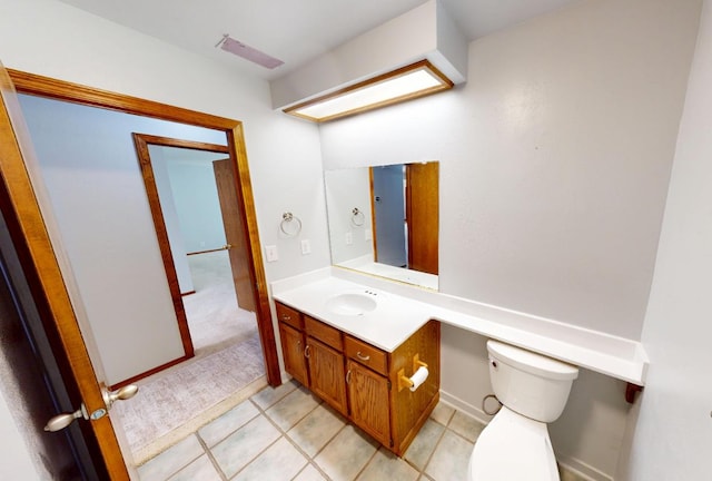 1604 W Central Ave, Madera, CA 93637 - bathroom with vanity, toilet, and tile patterned floors
