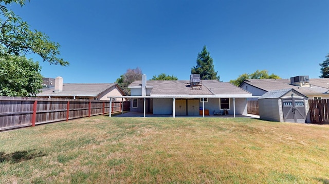 1604 W Central Ave, Madera, CA 93637 - back of property featuring a fenced backyard, a patio, and a shed