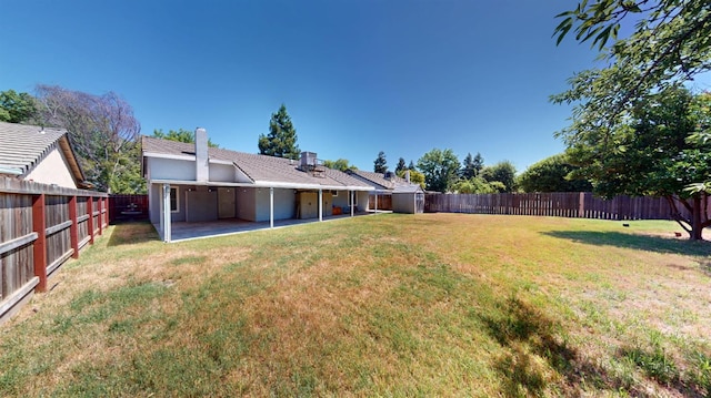 1604 W Central Ave, Madera, CA 93637 - fenced backyard featuring a patio area