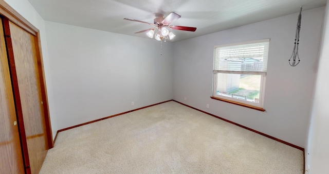 1604 W Central Ave, Madera, CA 93637 - unfurnished bedroom featuring light colored carpet, a closet, and a ceiling fan