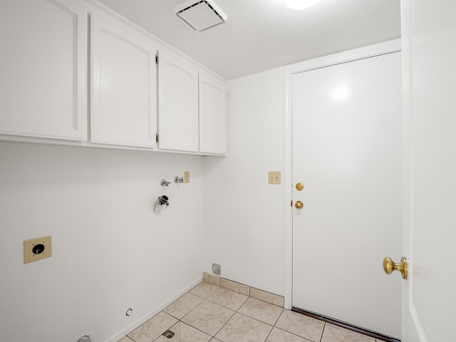7549 N 8th, Fresno, CA 93720 - washroom featuring hookup for an electric dryer, cabinet space, light tile patterned floors, gas dryer hookup, and baseboards