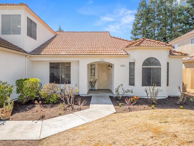 7549 N 8th, Fresno, CA 93720 - mediterranean / spanish-style home with a tiled roof and stucco siding