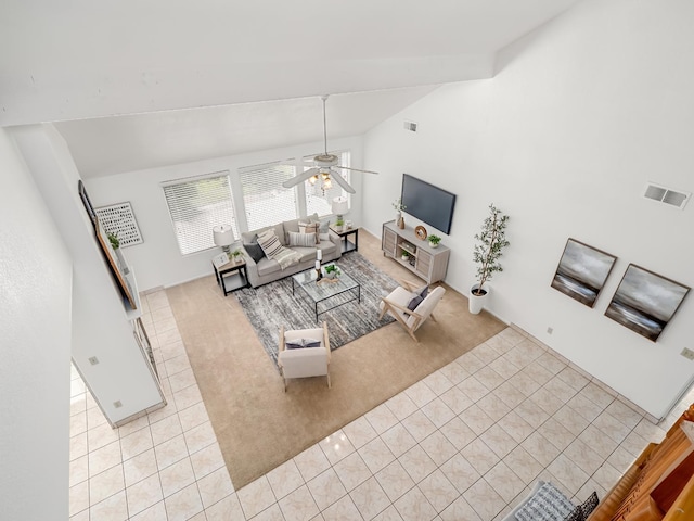 7549 N 8th, Fresno, CA 93720 - living area featuring vaulted ceiling, light colored carpet, light tile patterned floors, and a ceiling fan
