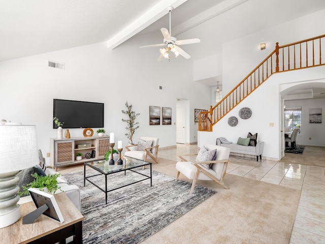 7549 N 8th, Fresno, CA 93720 - living room featuring stairway, a ceiling fan, high vaulted ceiling, arched walkways, and beamed ceiling