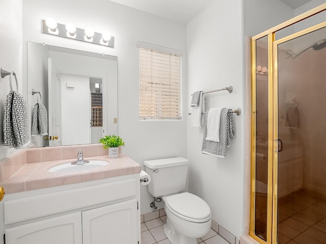 7549 N 8th, Fresno, CA 93720 - bathroom featuring vanity, tile patterned flooring, a shower stall, and toilet
