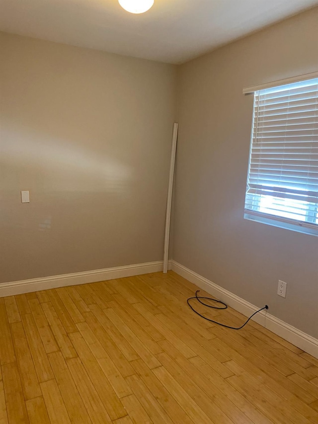 7371 N Highland, Clovis, CA 93619 - empty room with light wood-type flooring and baseboards