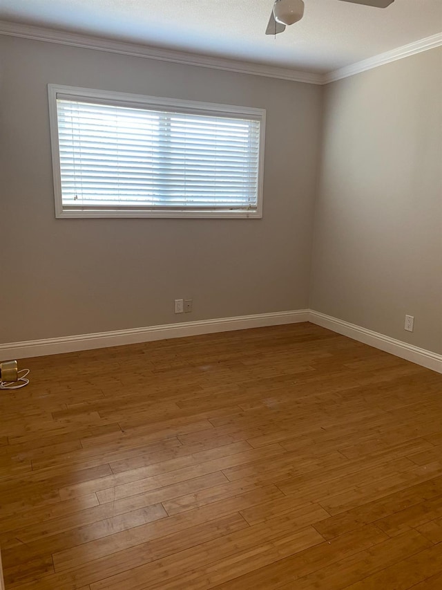 7371 N Highland, Clovis, CA 93619 - spare room featuring crown molding, ceiling fan, light wood-style flooring, and baseboards