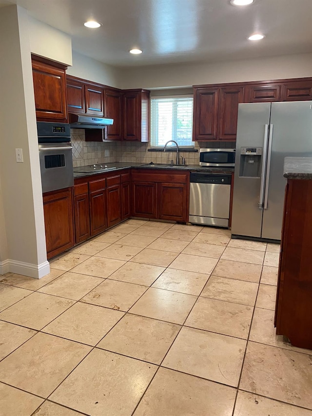 7371 N Highland, Clovis, CA 93619 - kitchen featuring stainless steel appliances, decorative backsplash, dark countertops, under cabinet range hood, and recessed lighting