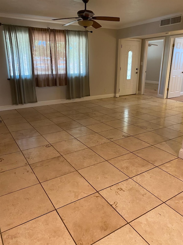 7371 N Highland, Clovis, CA 93619 - foyer with ornamental molding, ceiling fan, light tile patterned flooring, healthy amount of natural light, and baseboards