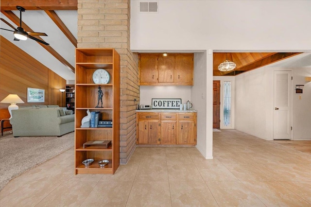 3595 W Magill Ave, Fresno, CA 93711 - kitchen with light tile patterned flooring, ceiling fan, a high ceiling, light countertops, and beamed ceiling