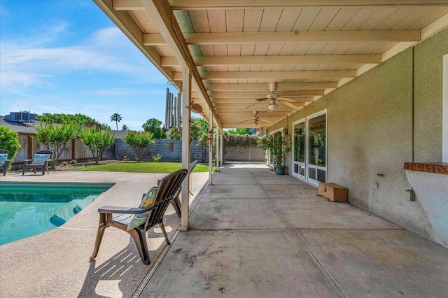 3595 W Magill Ave, Fresno, CA 93711 - fenced backyard with a ceiling fan and a patio