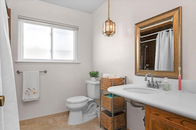 3595 W Magill Ave, Fresno, CA 93711 - bathroom with toilet, a sink, baseboards, and curtained shower