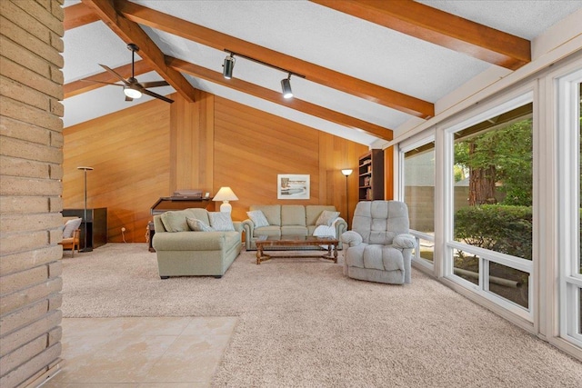 3595 W Magill Ave, Fresno, CA 93711 - living room featuring wooden walls, carpet flooring, and ceiling fan