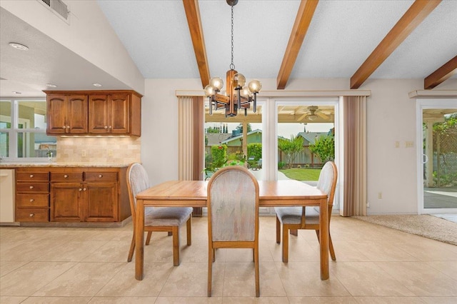 3595 W Magill Ave, Fresno, CA 93711 - dining space featuring a chandelier, beam ceiling, and light tile patterned floors