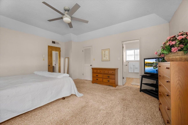 3595 W Magill Ave, Fresno, CA 93711 - bedroom with carpet flooring, a textured ceiling, a ceiling fan, and ensuite bath