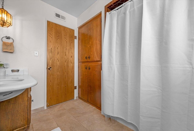 3595 W Magill Ave, Fresno, CA 93711 - bathroom with vanity, curtained shower, and tile patterned floors