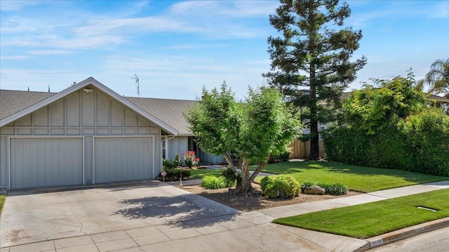 3595 W Magill Ave, Fresno, CA 93711 - view of front of house featuring driveway, a garage, board and batten siding, and roof with shingles
