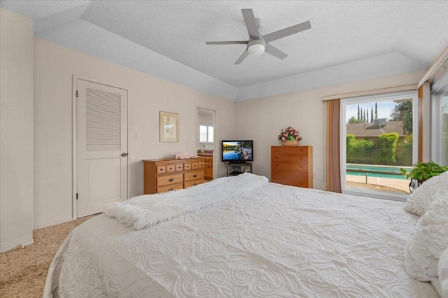 3595 W Magill Ave, Fresno, CA 93711 - carpeted bedroom with access to exterior, lofted ceiling, a textured ceiling, and a ceiling fan