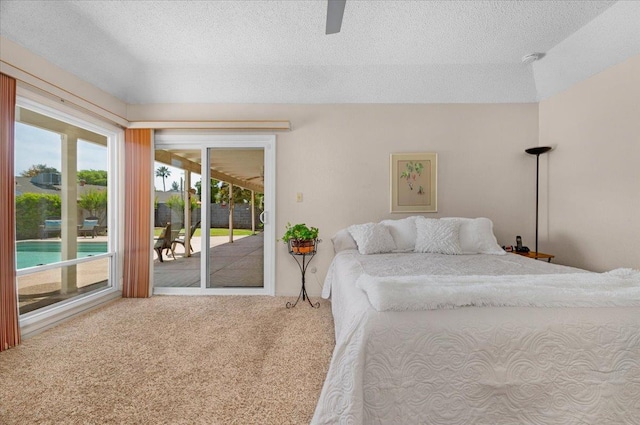 3595 W Magill Ave, Fresno, CA 93711 - carpeted bedroom featuring access to exterior, a textured ceiling, and a ceiling fan