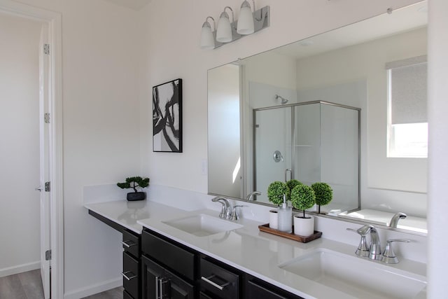 508 Laurel Crest Ave, Madera, CA 93636 - full bathroom featuring a stall shower, double vanity, and wood finished floors