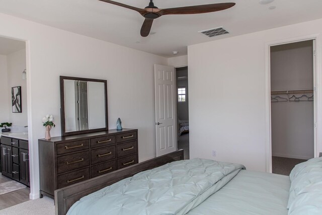 508 Laurel Crest Ave, Madera, CA 93636 - bedroom with a spacious closet, ensuite bathroom, ceiling fan, and a closet