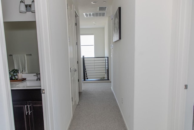 508 Laurel Crest Ave, Madera, CA 93636 - hall featuring an upstairs landing, a sink, carpet, and baseboards