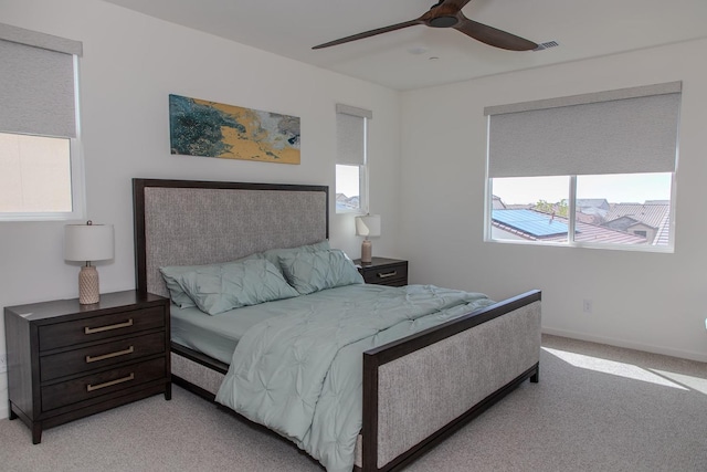 508 Laurel Crest Ave, Madera, CA 93636 - bedroom with multiple windows, light colored carpet, a ceiling fan, and baseboards