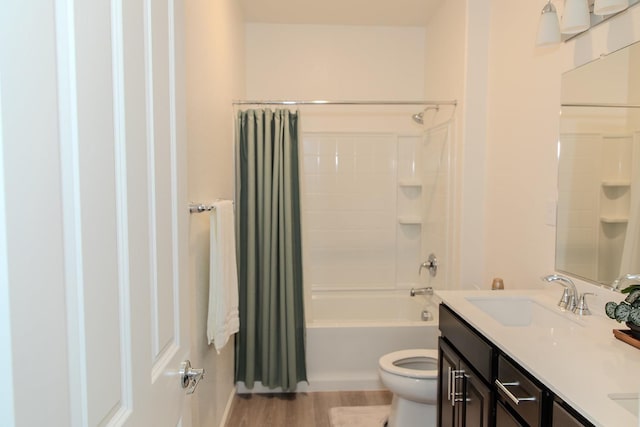 508 Laurel Crest Ave, Madera, CA 93636 - bathroom with double vanity, shower / bath combination with curtain, toilet, and wood finished floors