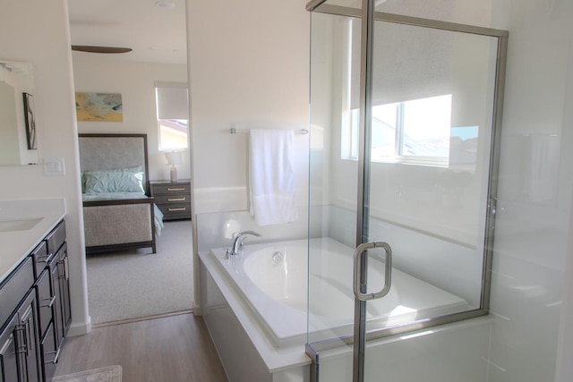 508 Laurel Crest Ave, Madera, CA 93636 - ensuite bathroom featuring vanity, a bath, wood finished floors, and a stall shower